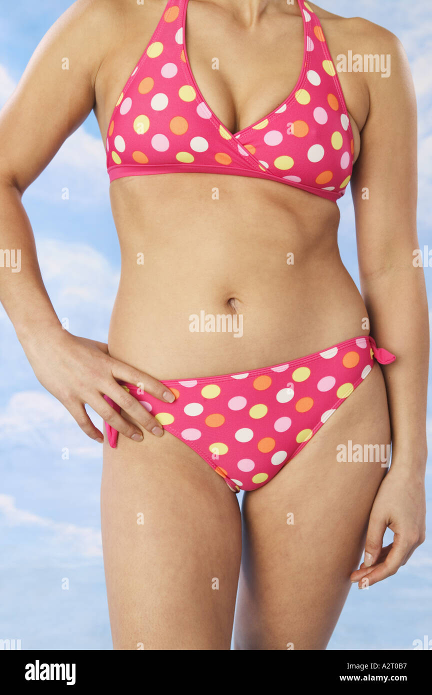 Woman wearing pink polka dot bikini Stock Photo