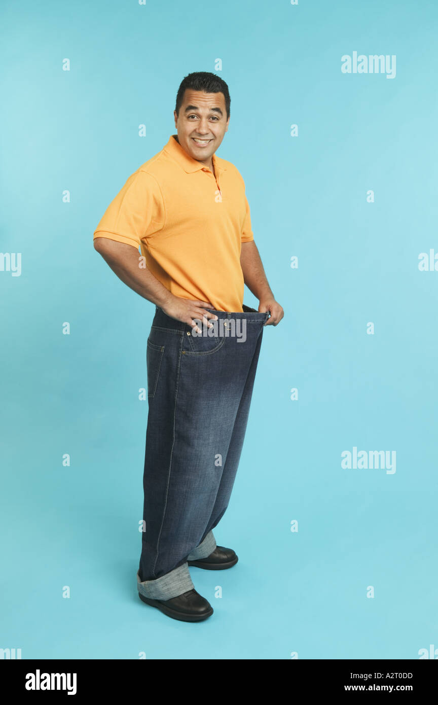 Man wearing pants that are too large Stock Photo