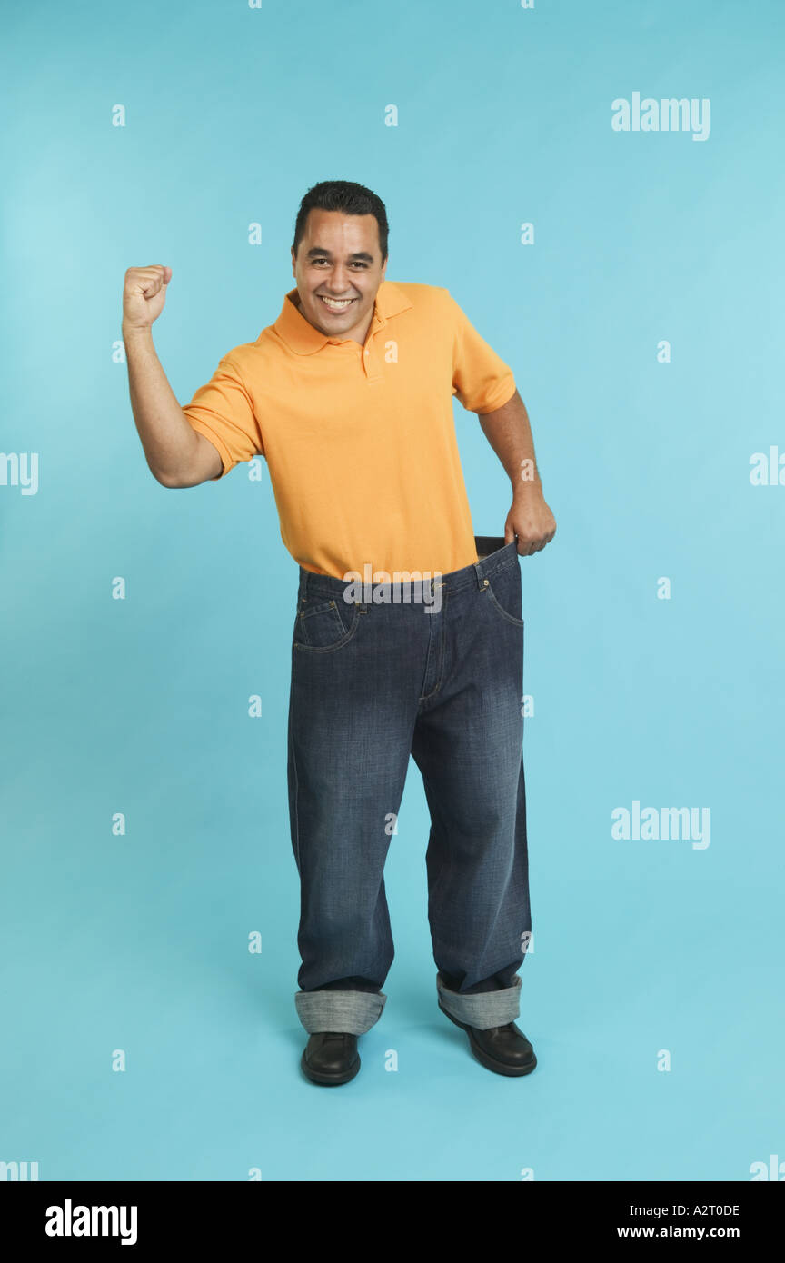 Man wearing pants that are too large Stock Photo