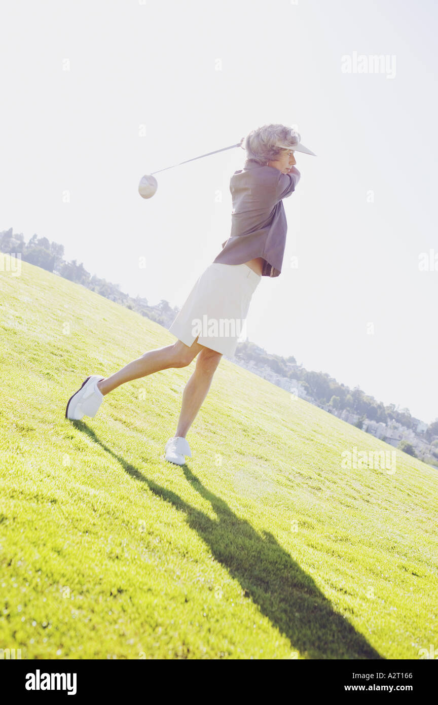A woman playing golf Stock Photo