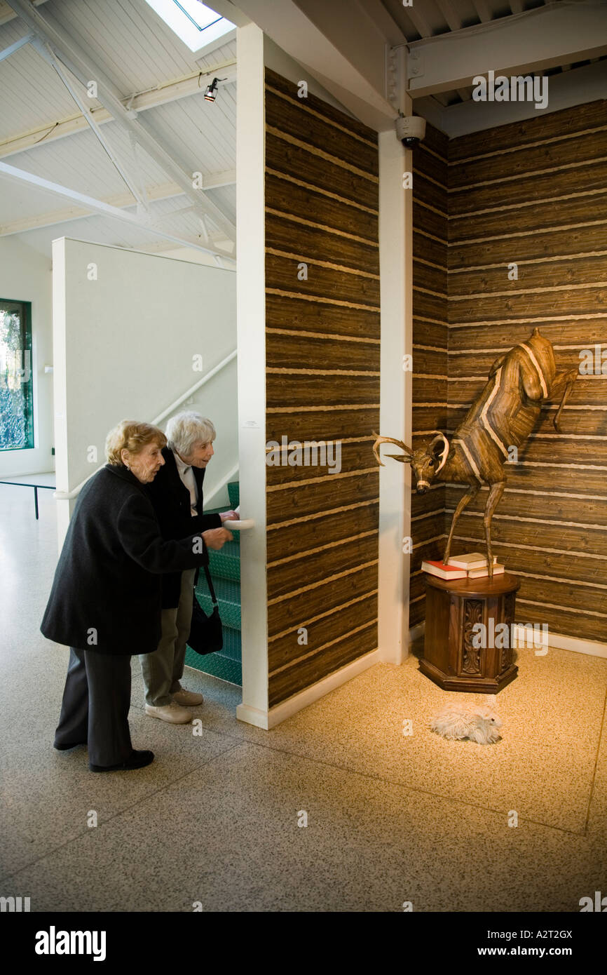 Two women look at the work of Carolyn Hopkins at Grounds For Sculpture Hamilton New Jersey USA Stock Photo