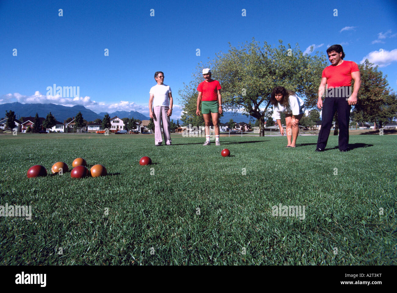 Bocce Players playing the Italian Game of Bocce Ball in a Park in East Vancouver British Columbia Canada Stock Photo