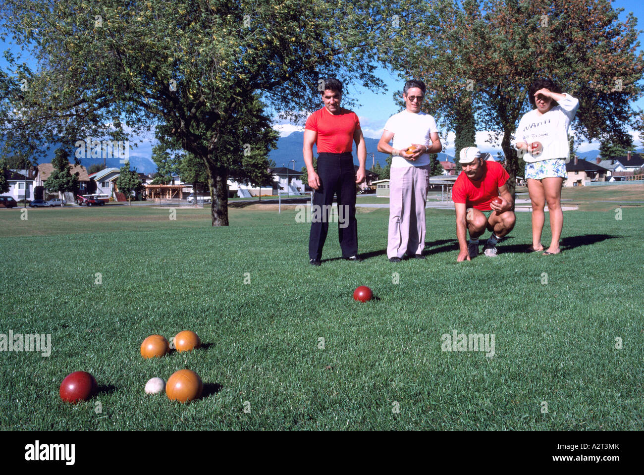 Bocce Players playing the Italian Game of Bocce Ball in a Park in East Vancouver British Columbia Canada Stock Photo