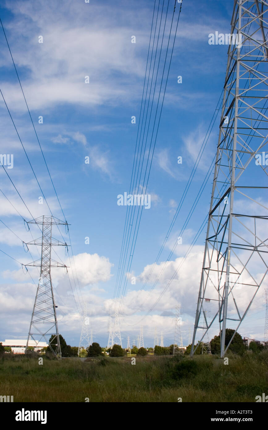 Electrical poles and power lines against a blue sky Stock Photo - Alamy