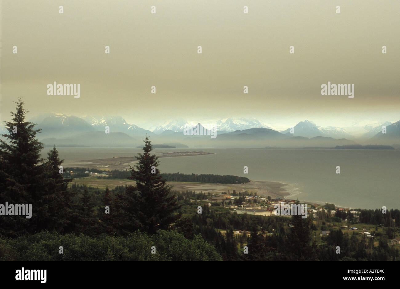 Smoke from forest fires over city Homer and Kachemak Bay Kenai Peninsula Alaska Stock Photo