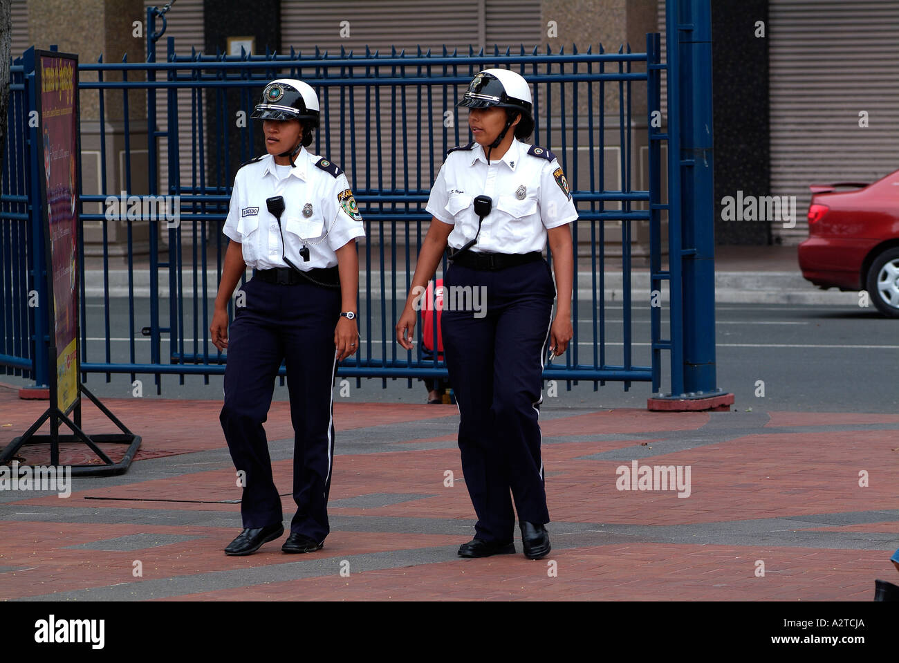 Two policewomen walking in a street of Guayaquil, Ecuador. Stock Photo