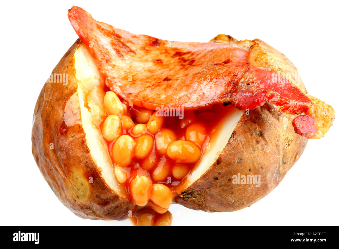 Baked Jacket Potato With Bacon and Baked Beans Isolated Against A White