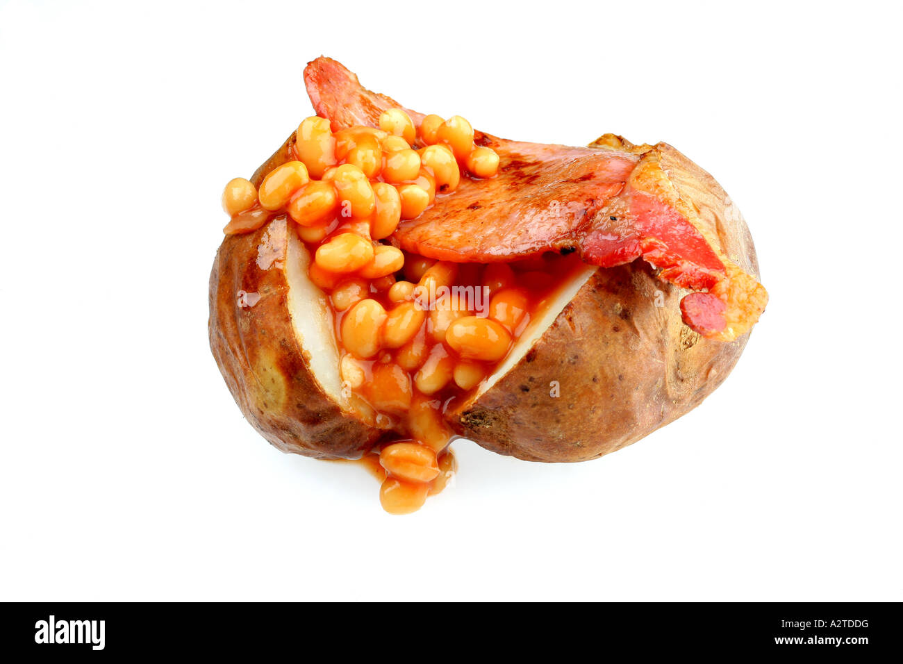 Baked Jacket Potato With Bacon and Baked Beans Isolated Against A White