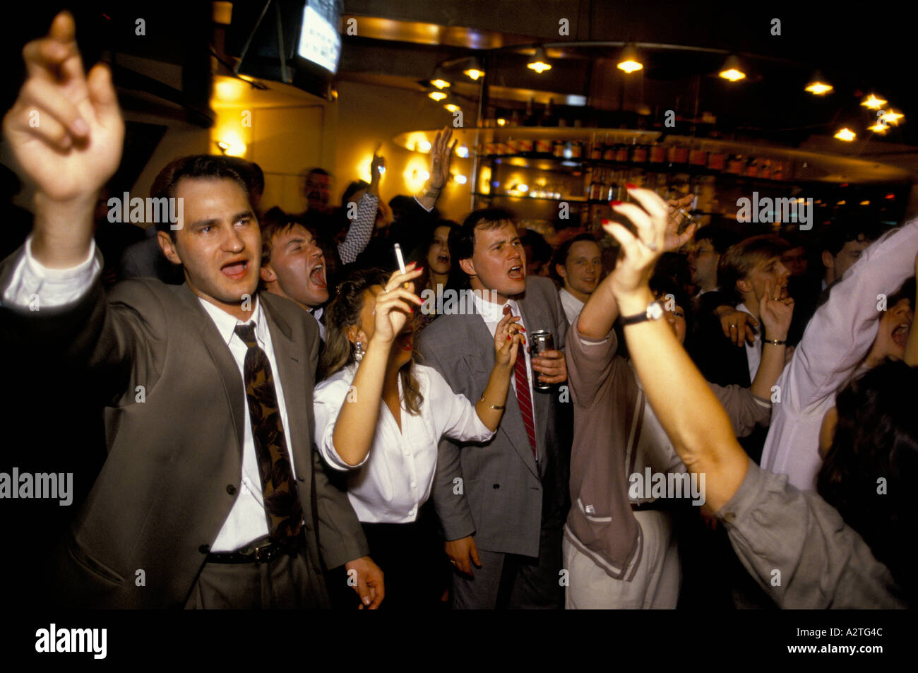 city workers singing karaoake in wine bar city of london 1991 Stock Photo