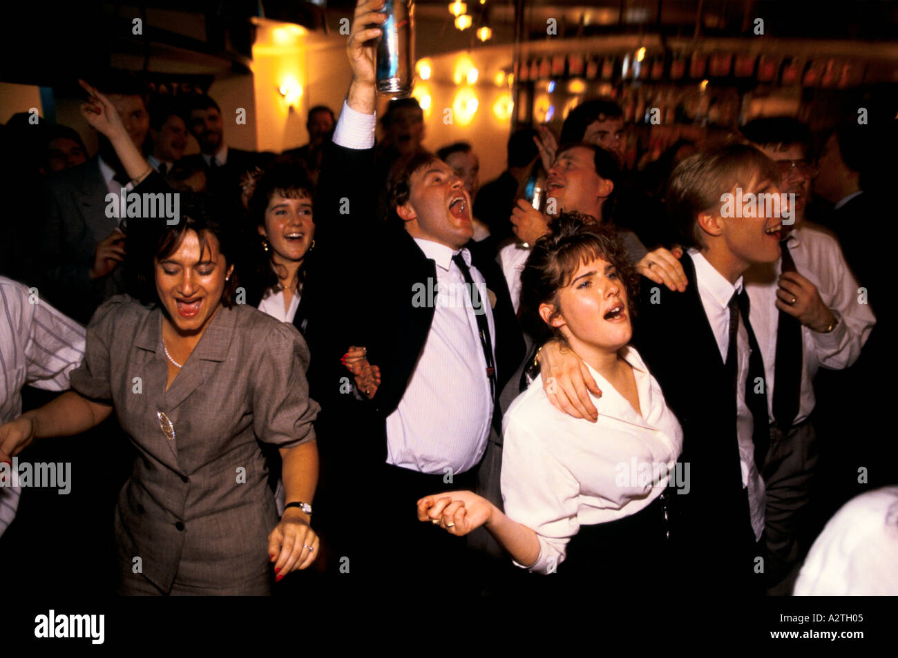 men women karaoke singing in city of london bar Stock Photo