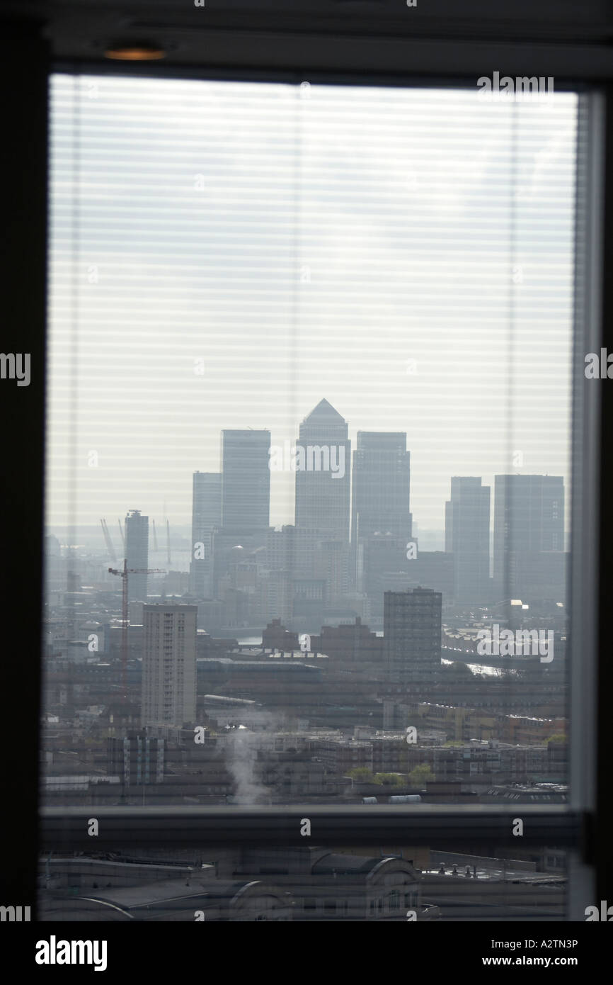 Abstract image of Canary Wharf buildings through venetian blinds of ...