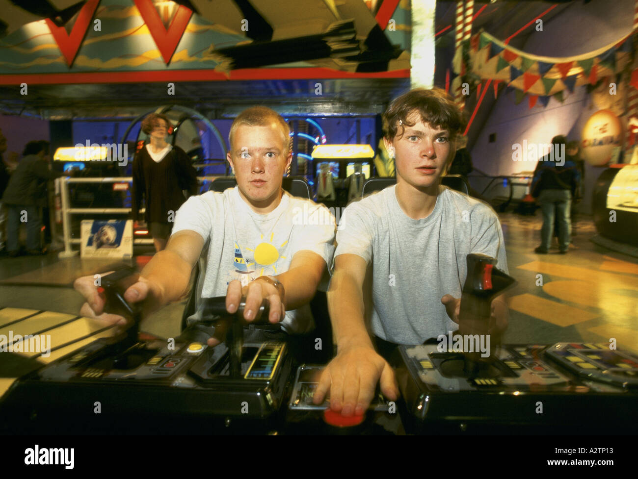 teenaged boys playing video games in sega world at the trocadero london 1997 Stock Photo