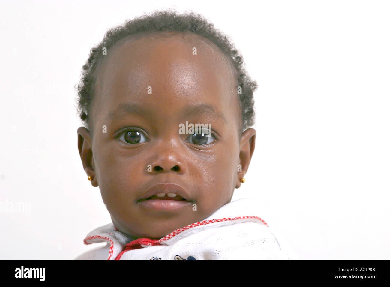 Black baby girl with a half smile Stock Photo Alamy