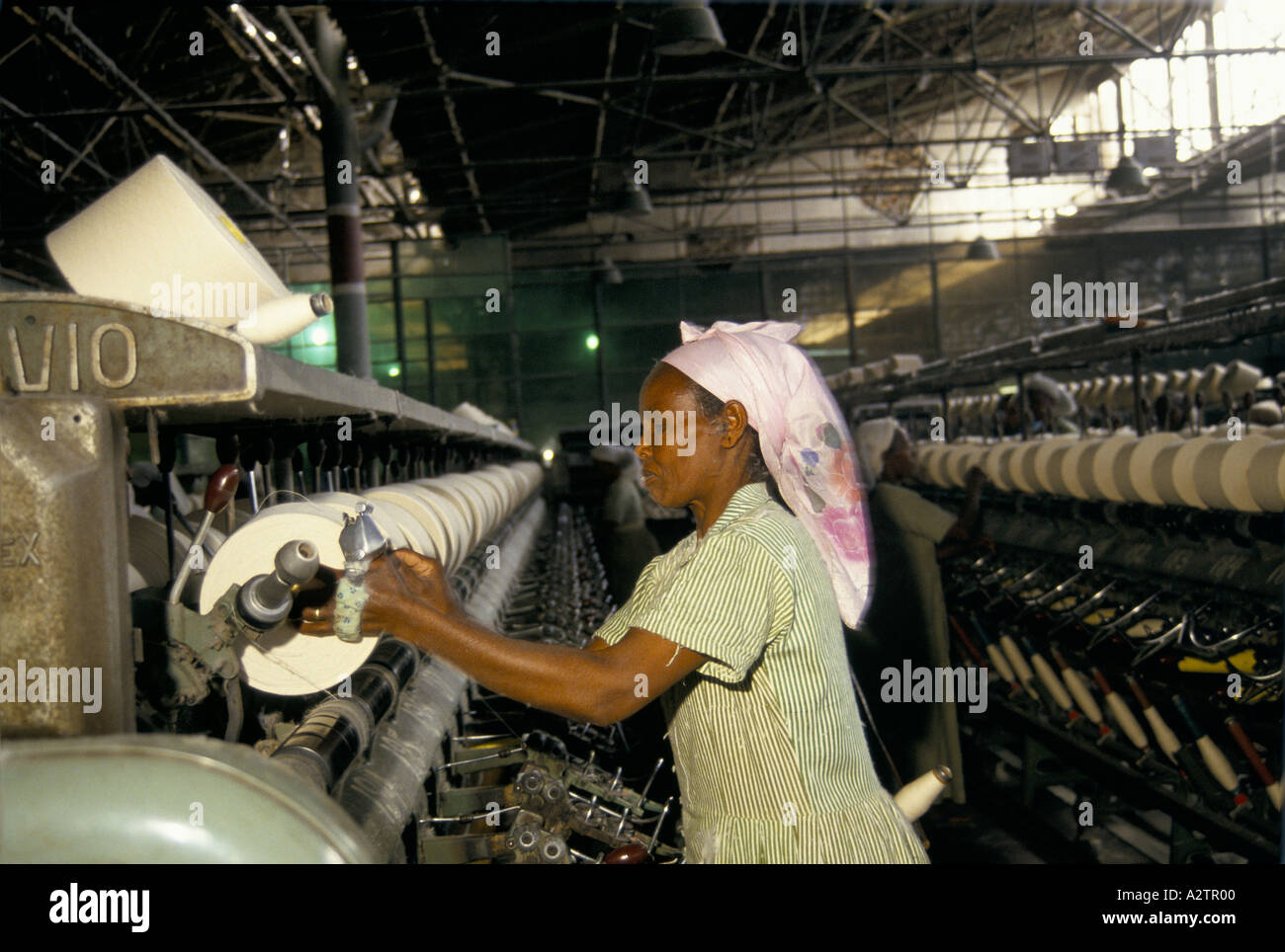 Woman factory worker operating machine hi-res stock photography and ...
