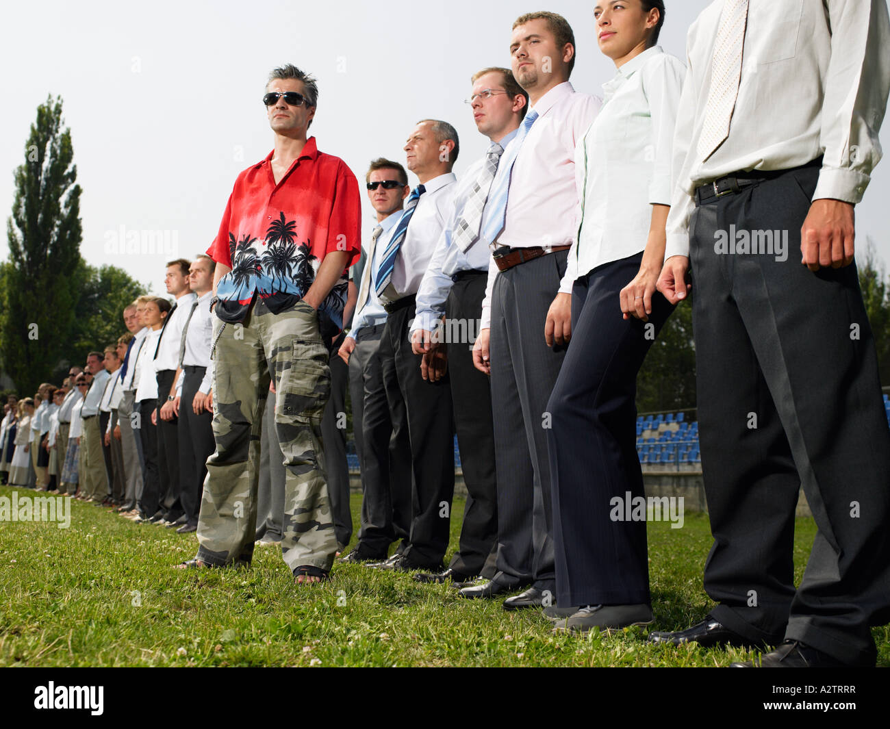 Man standing out from the crowd Stock Photo
