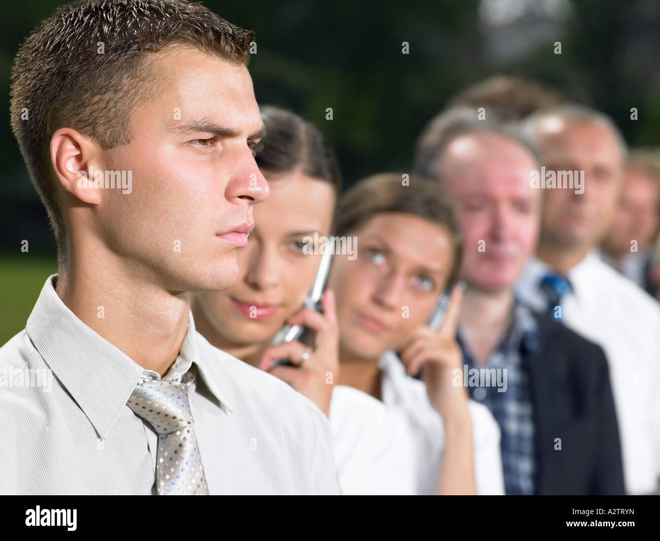 Businessman in a queue Stock Photo