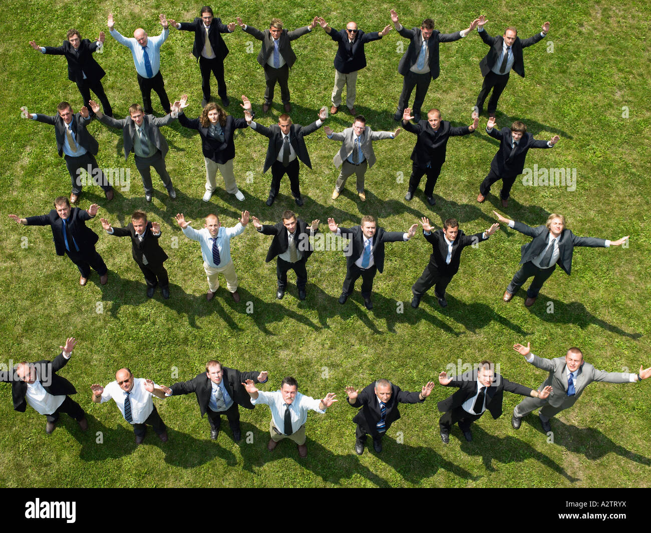 Businessmen with their arms in the air Stock Photo