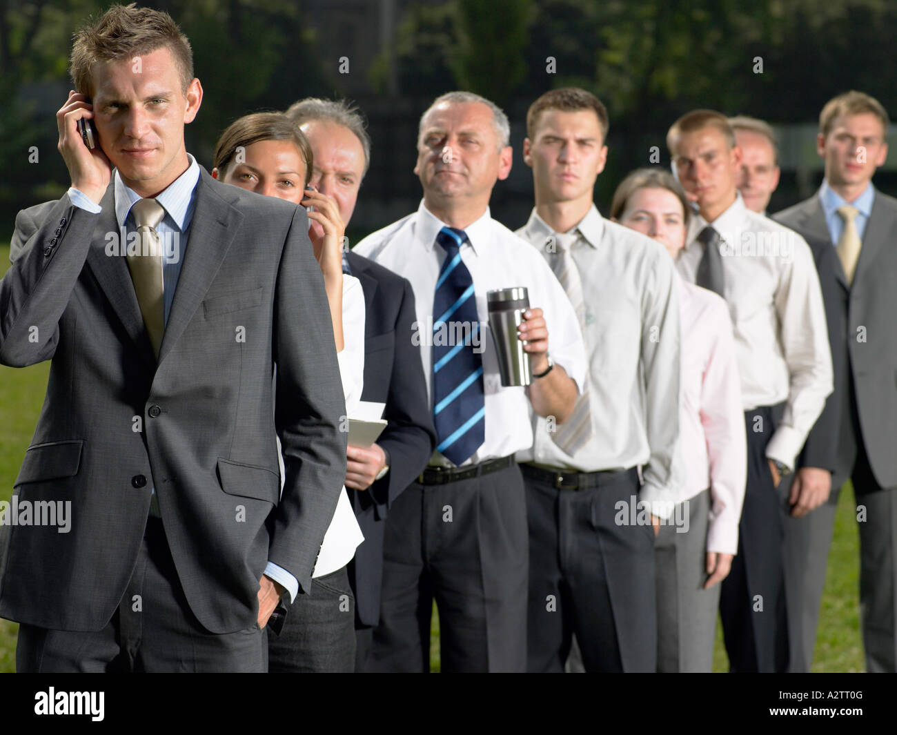 Businesspeople in a queue Stock Photo