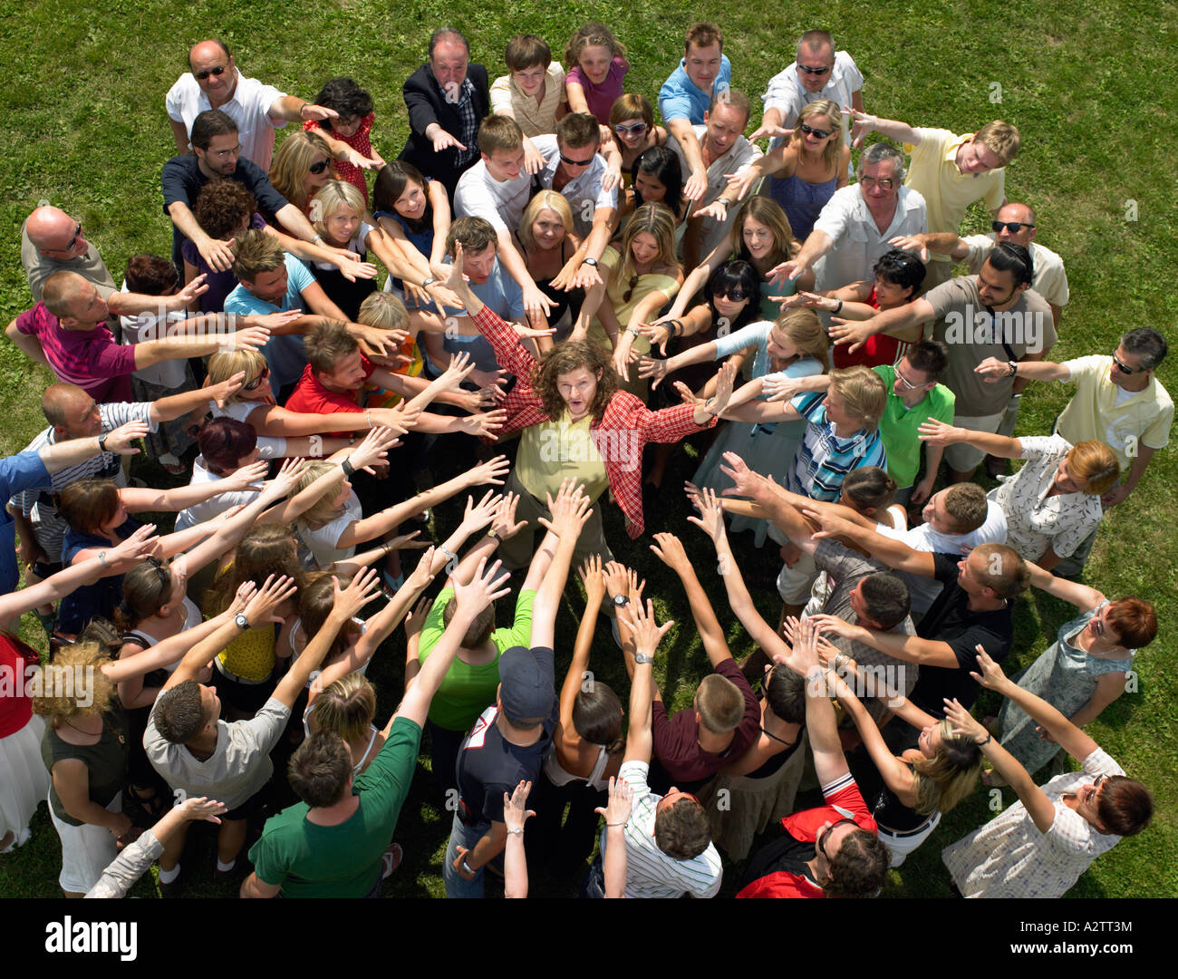 Man in the middle of a crowd Stock Photo