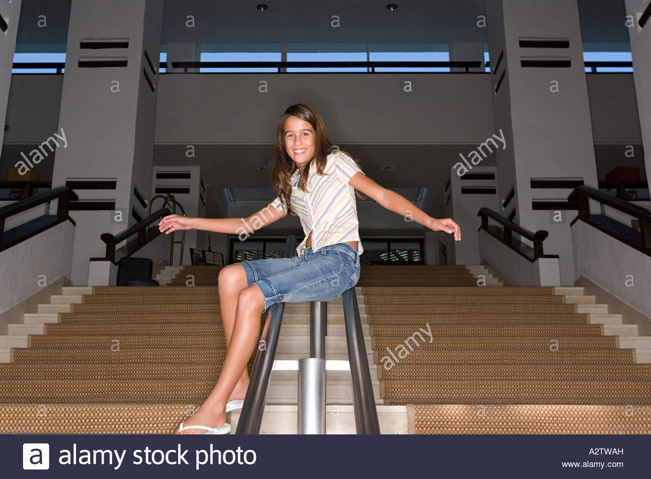 Girl Sliding Down A Banister Stock Photo 10595656 Alamy