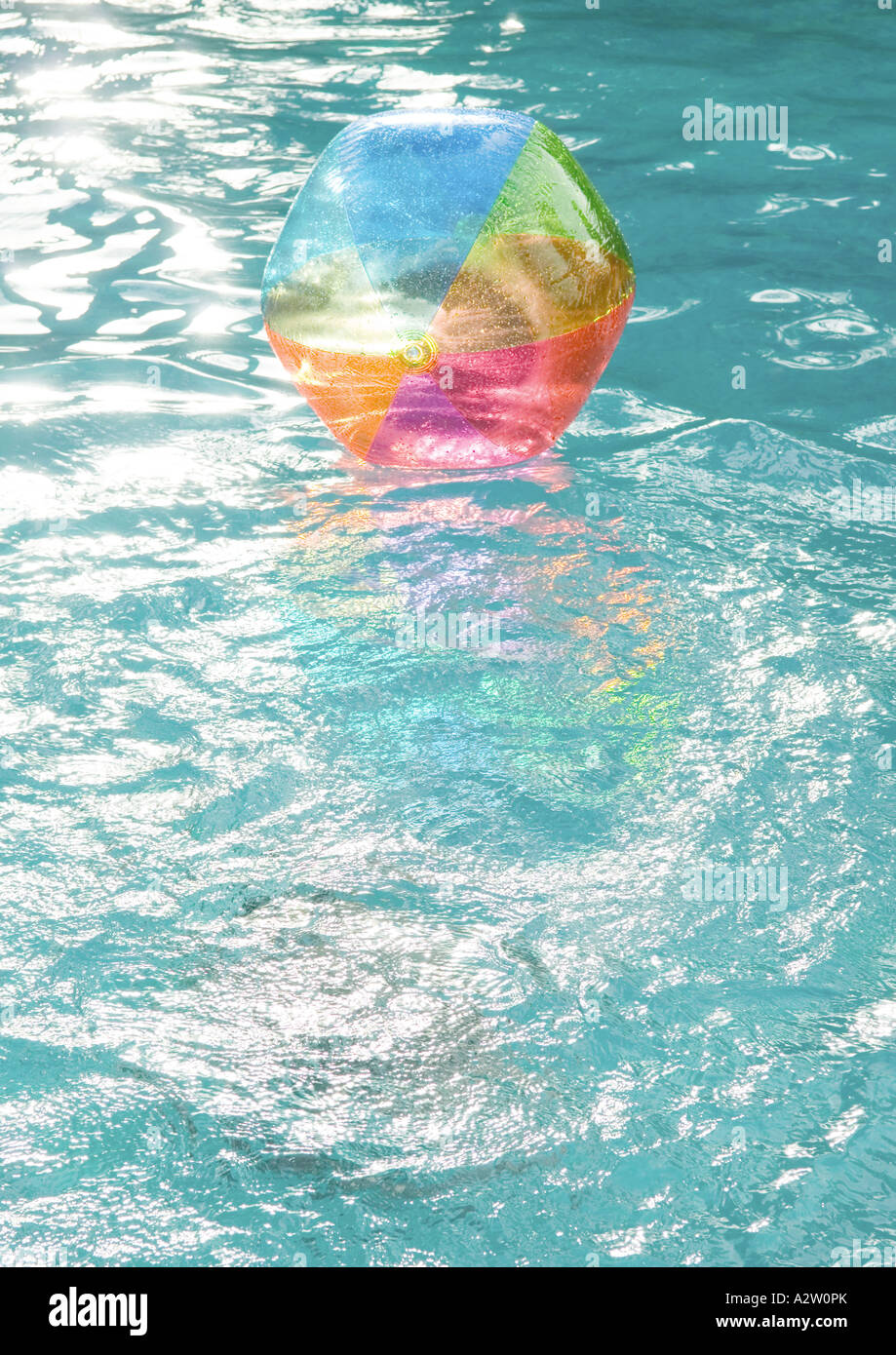 Beach ball floating on surface of water Stock Photo Alamy