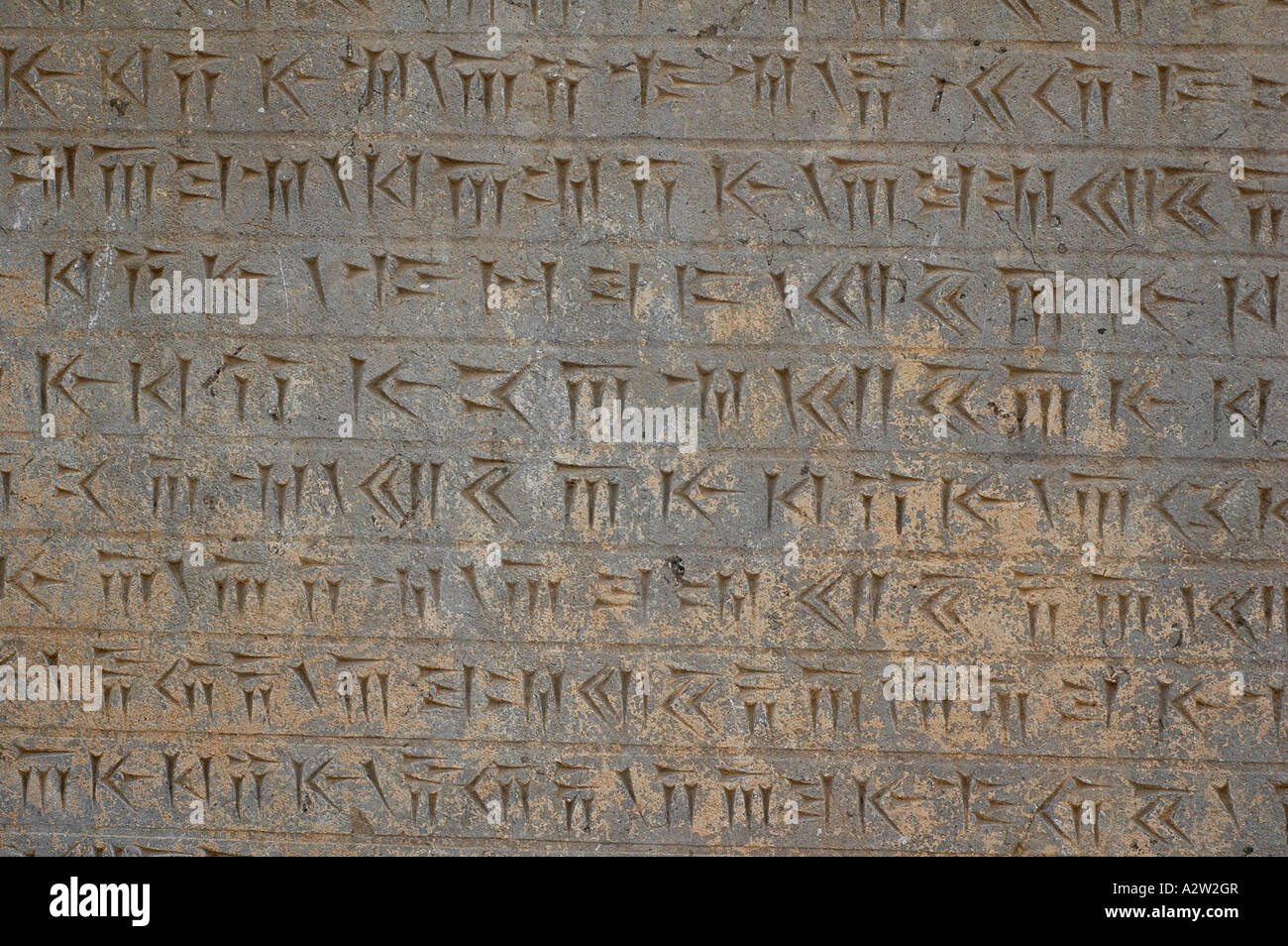 Ancient Persian script written on a piece on display in the Persepolis archeological site, near Shiraz, Iran. Stock Photo