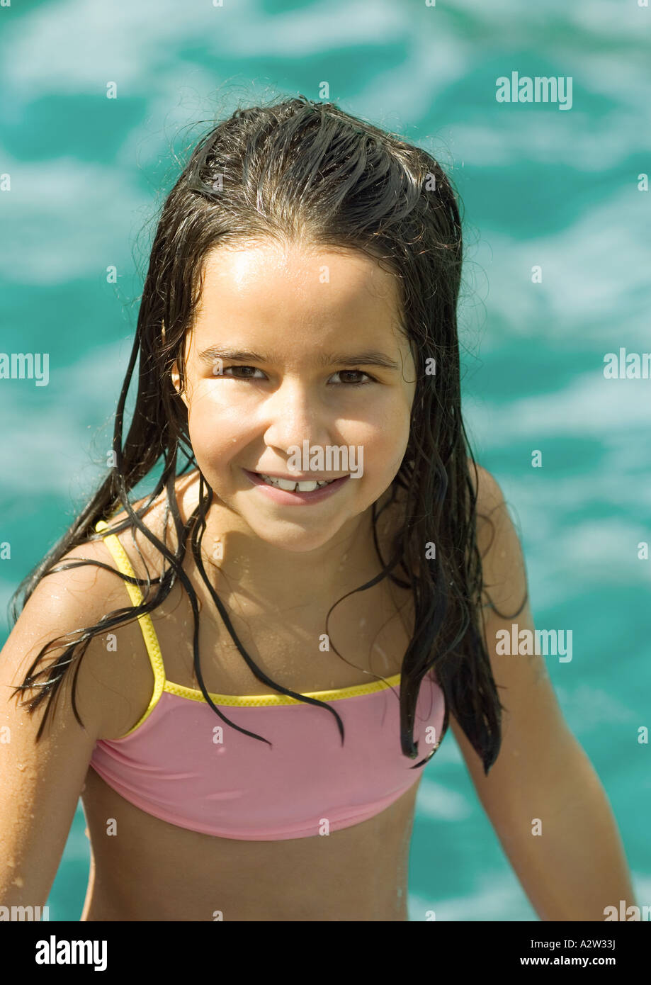 Girl in bathing suit, water in background, portrait Stock Photo - Alamy