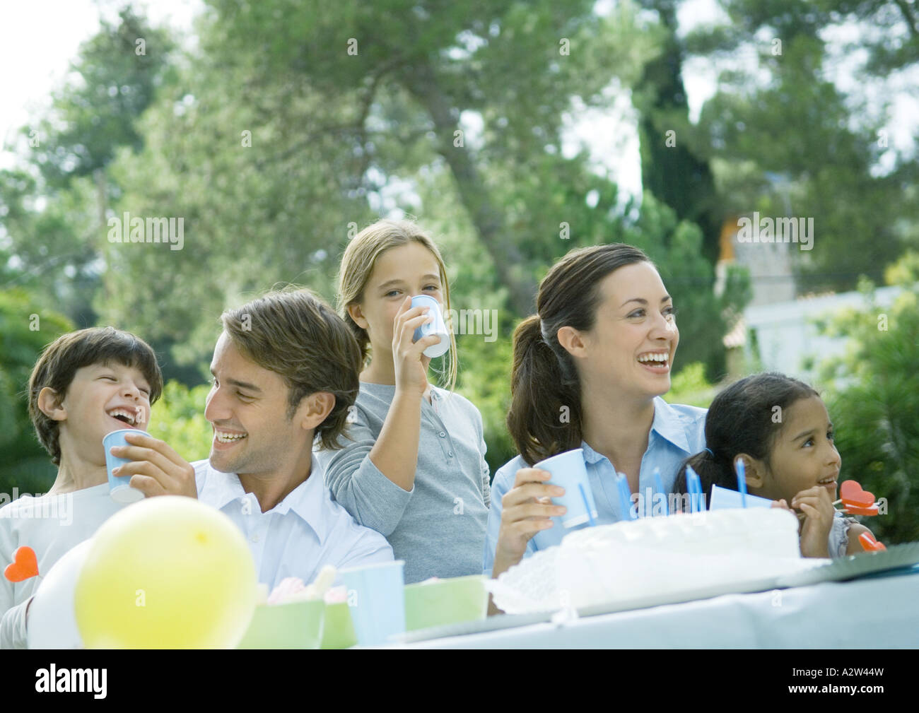 Family having outdoor birthday party Stock Photo