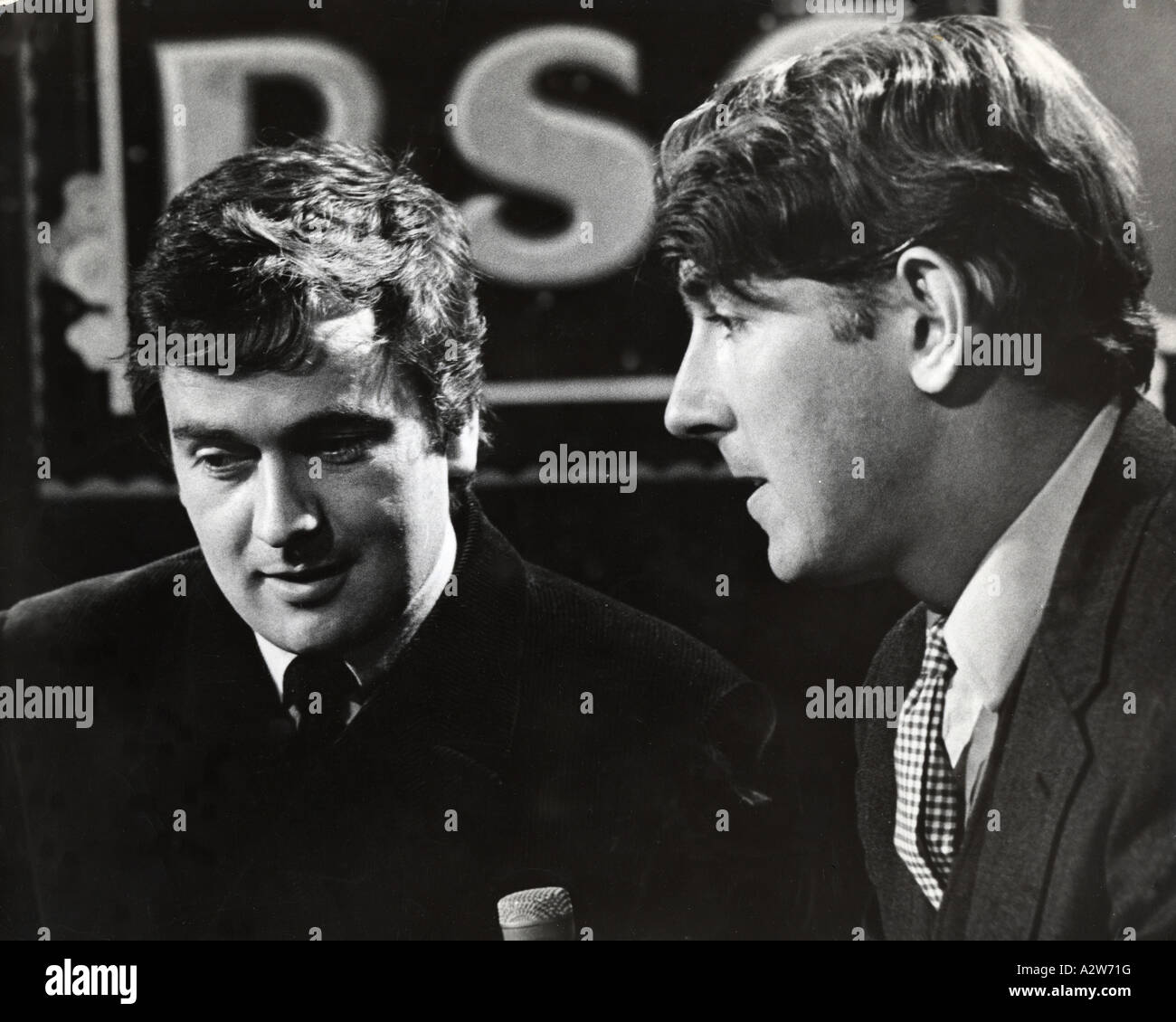 PETER COOK at right and Dudley Moore UK comedians on a TV show about 1958 Stock Photo