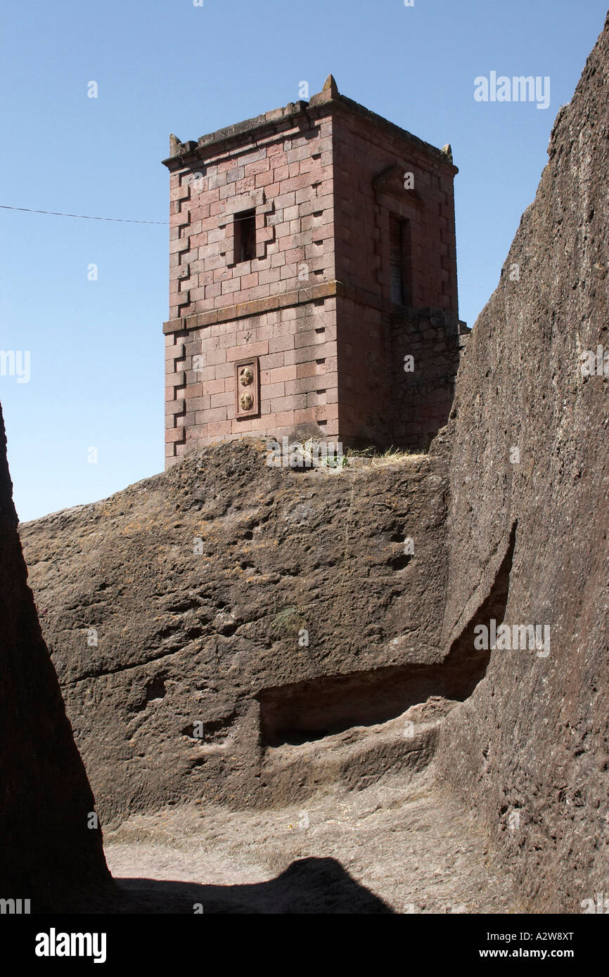 Priest in Bet Danaghel Church holding the Cross of King Lalibela. The  rock-hewn churches of Lalibela make it one of the greatest  Religio-Historical sites not only in Africa but in the Christian