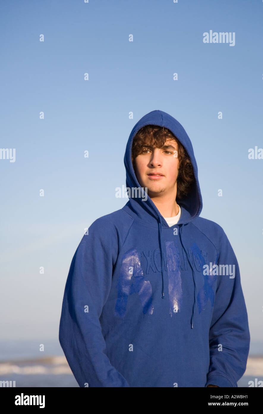 Teenage boy wearing blue hoody hi res stock photography and images