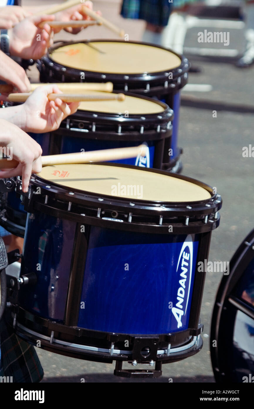 Three drummers in the percussion section of the Helensburgh pipeband laying down a rhythm Stock Photo