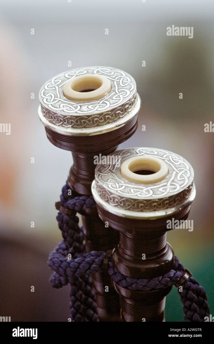 Close up of a set of bagpipe tenor drones and their decorative caps