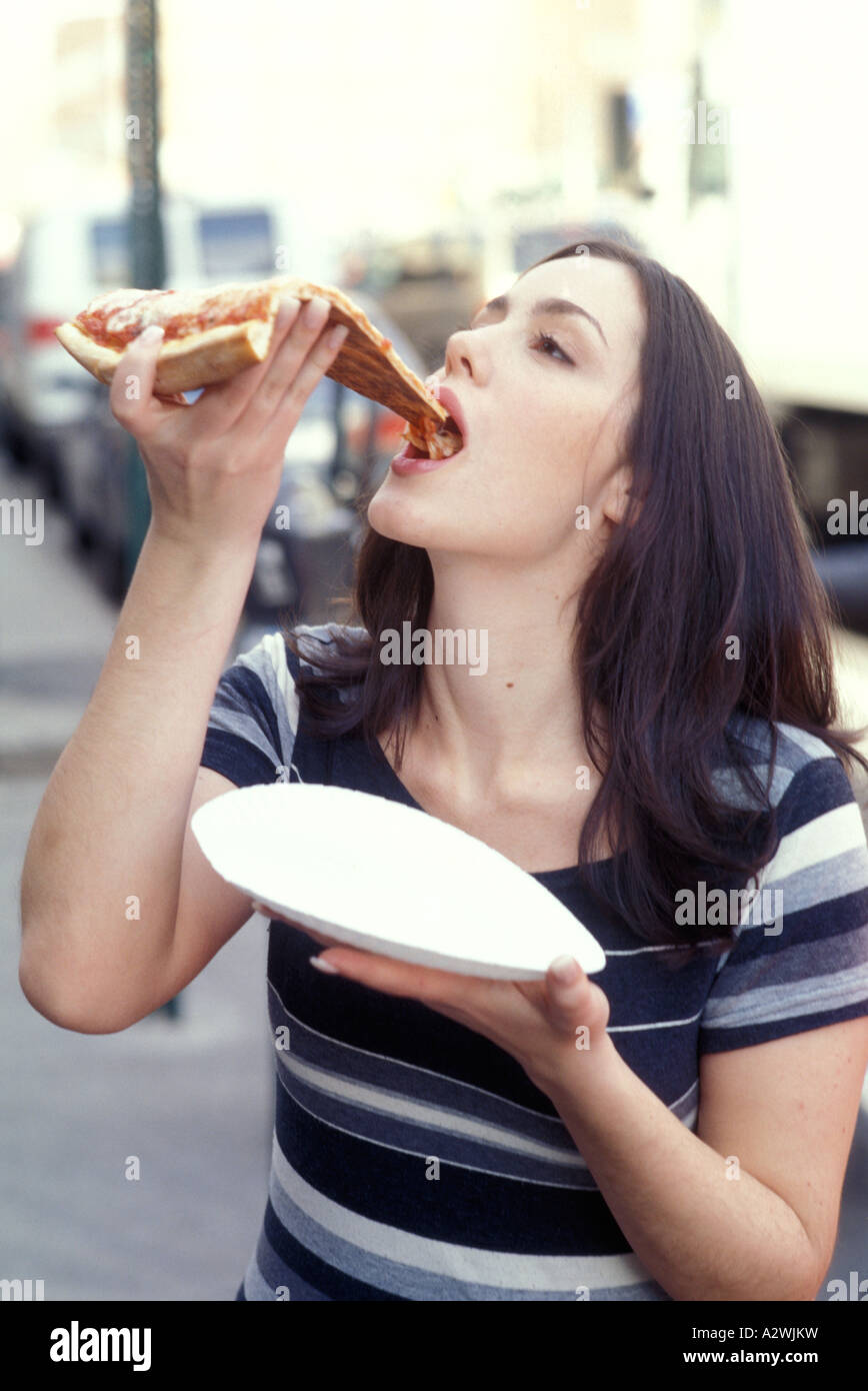 Woman eating pizza Stock Photo