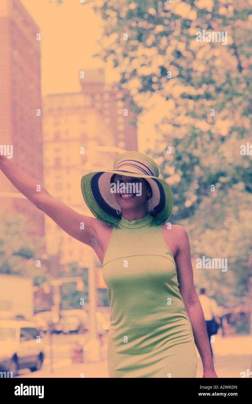 Happy african woman waving hand hi-res stock photography and images - Alamy