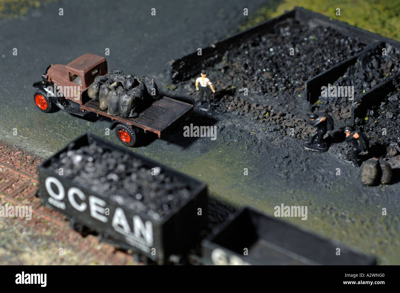 Coal trucks and carriages on a model railway set Stock Photo