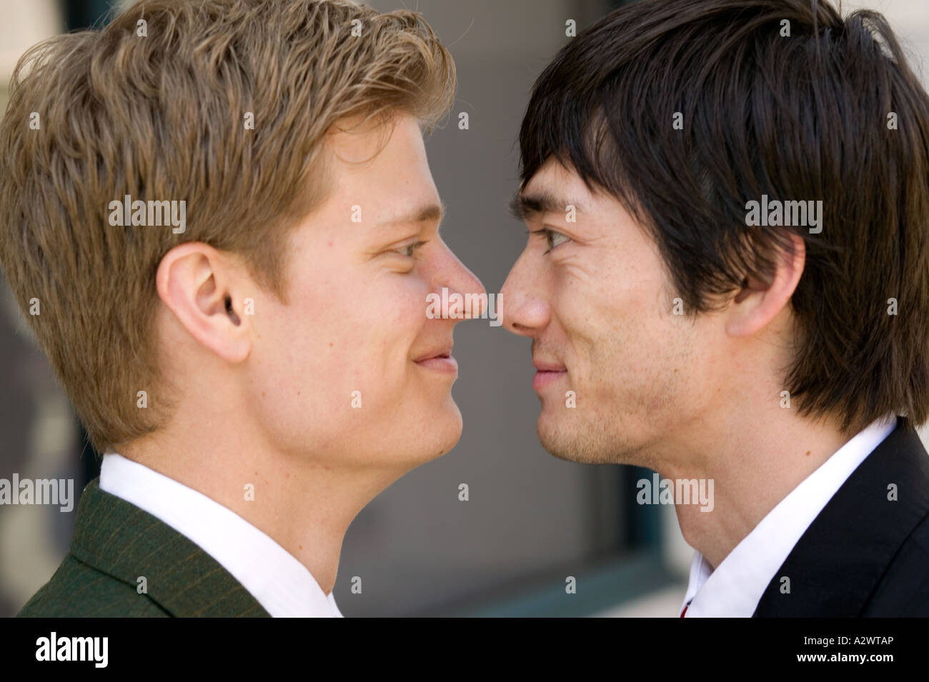 Businessmen looking at each other Stock Photo - Alamy