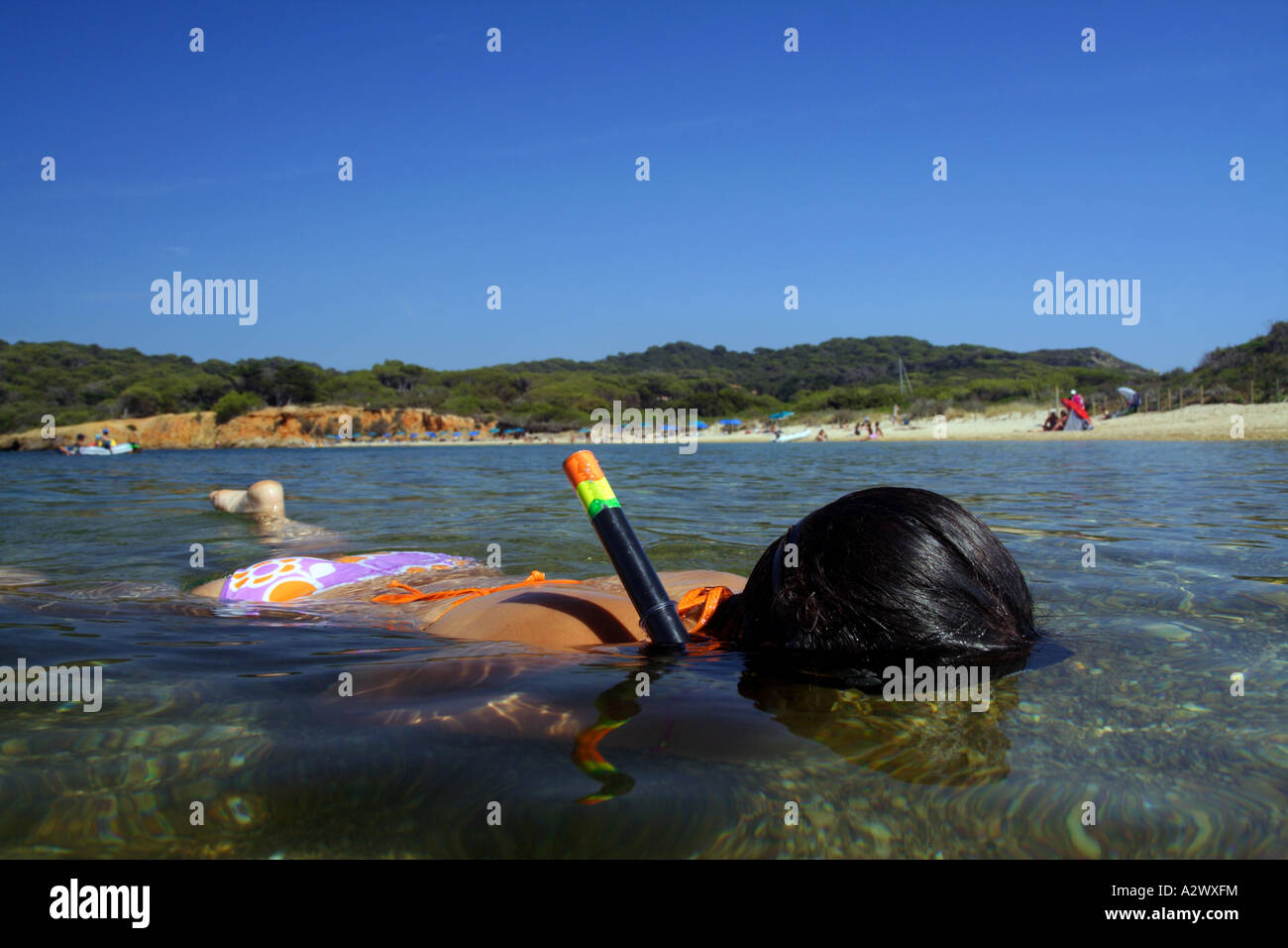 Young woman practicing snorkeling in the island of Porquerolles, France