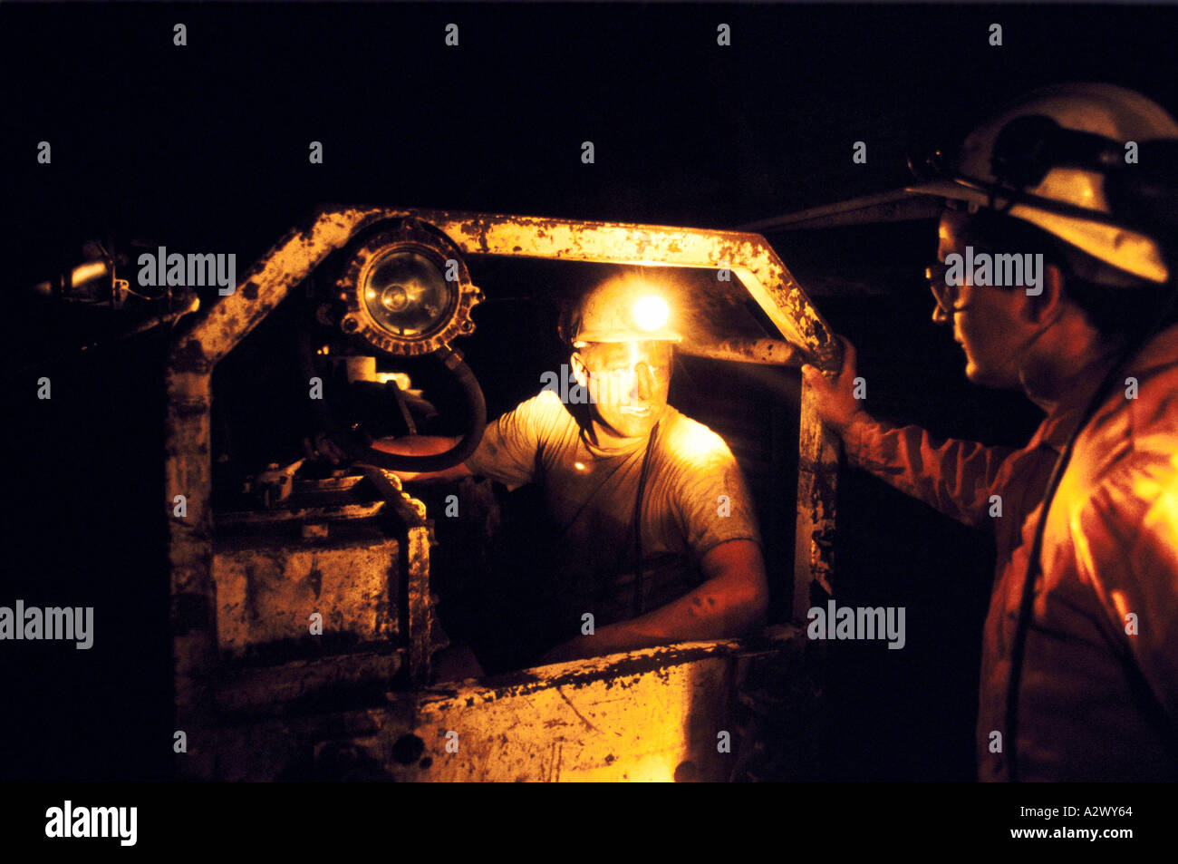 Miners underground, arriving at pit head in a coal wagon Stock Photo