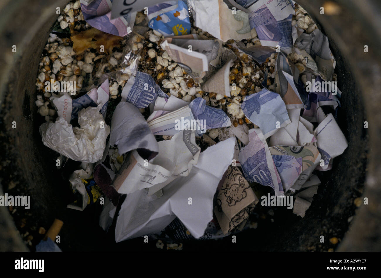 Belgrade under sanctions : Dina bank notes in rubbish bin.  These notes are now worthless due to hyper inflation, Dec 1993 Stock Photo
