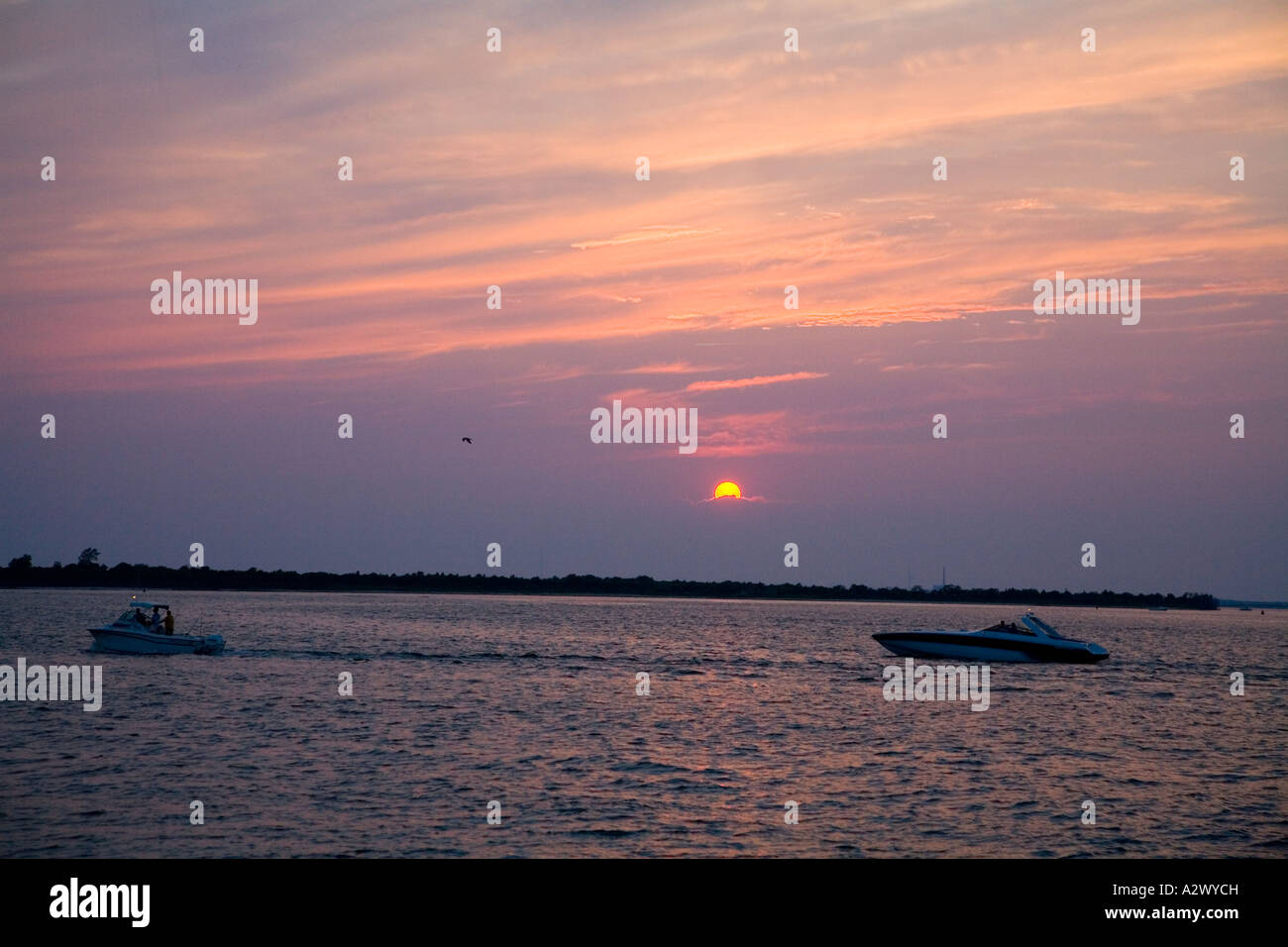 Fishing Boat in Sunset Stock Photo - Alamy