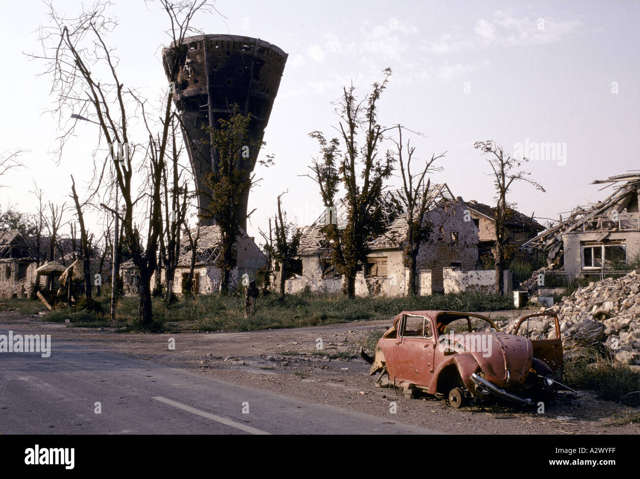 Vukovar, Croatia, under Serb control,  Feb 1992: The destroyed water tower stands above the rubble and blasted trees Stock Photo