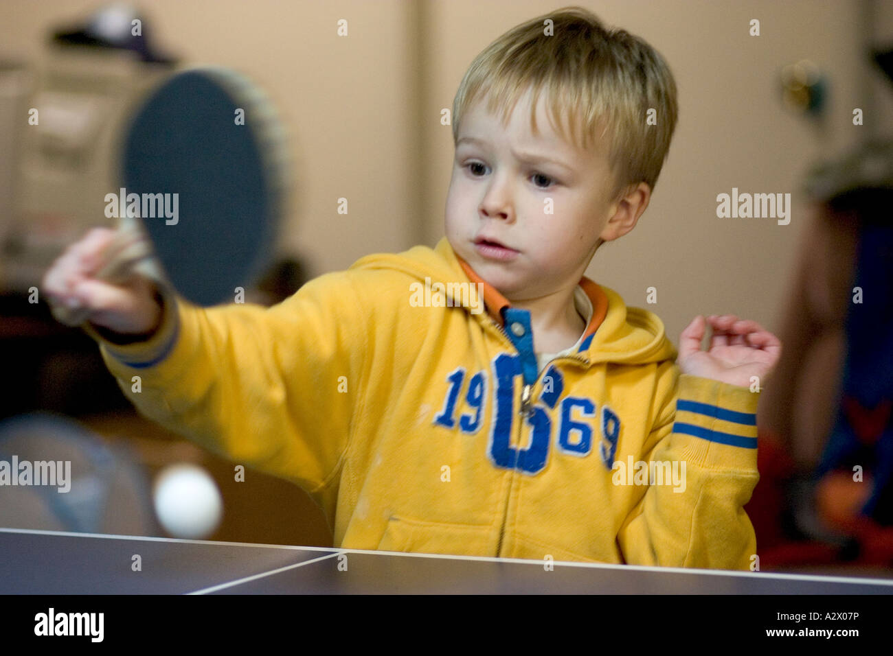 Boy age 5 playing ping pong. Downers Grove Illinois IL USA Stock Photo