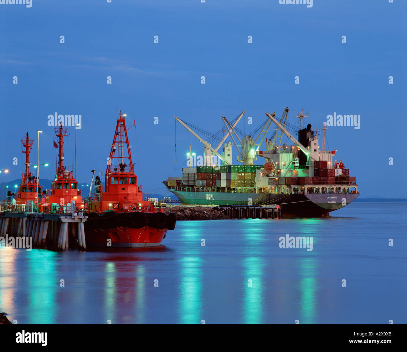 Australia. Queensland. Gladstone port. Container ship at night Stock