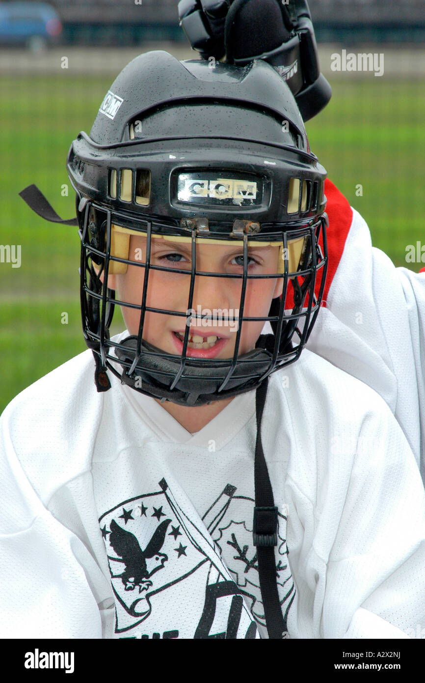 Young teenage male wearing a Roller hockey helmet with face grid Stock  Photo - Alamy