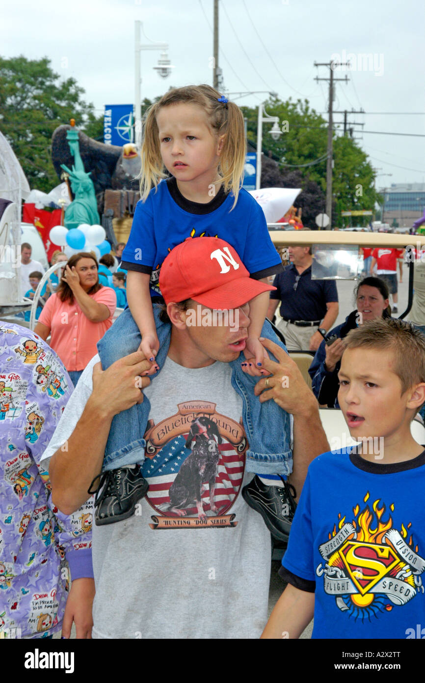 Family group of Father and two children at a parade in Detroit, MI Stock Photo