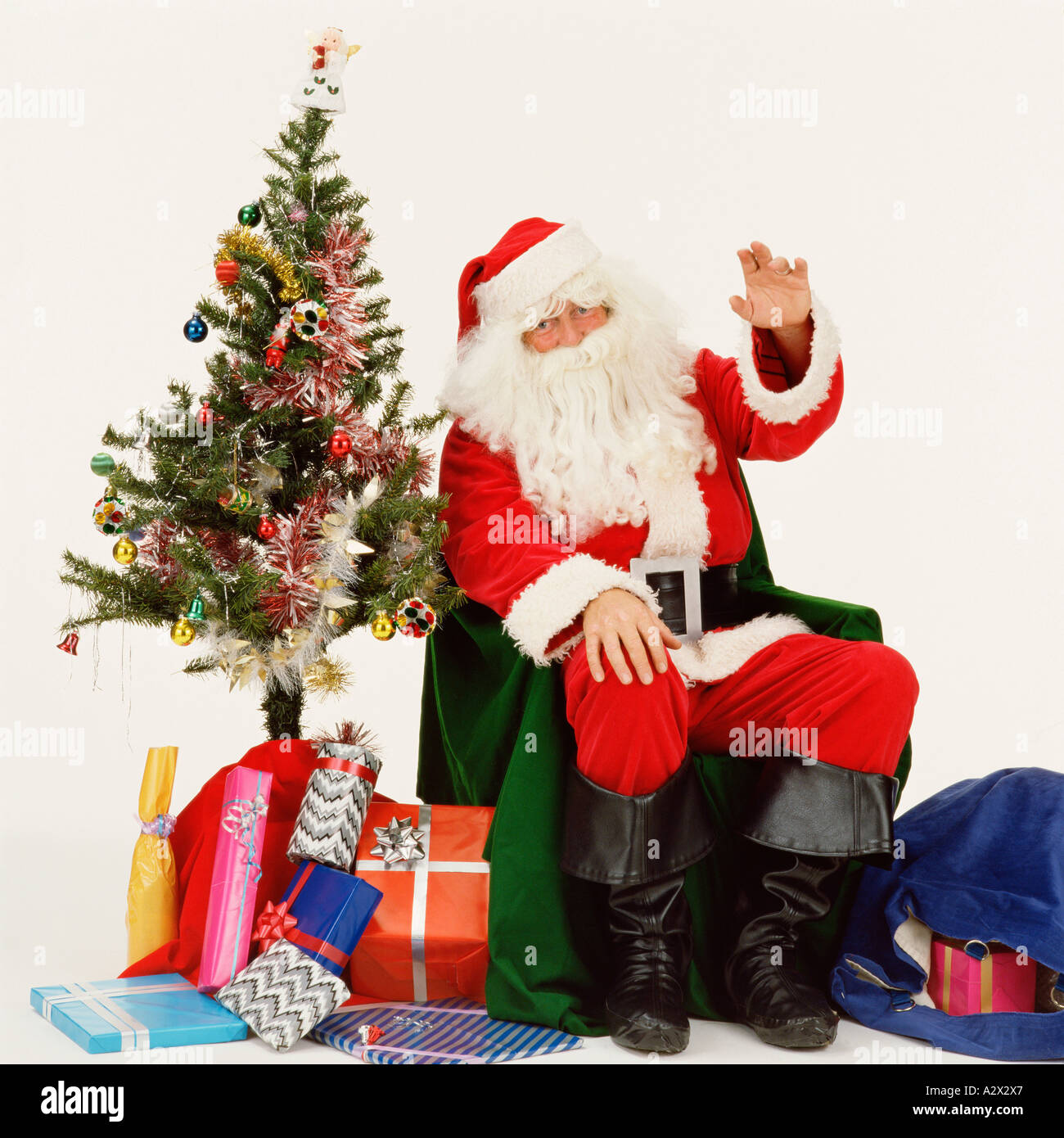 Studio image of Santa Claus (Father Christmas) waving. Stock Photo