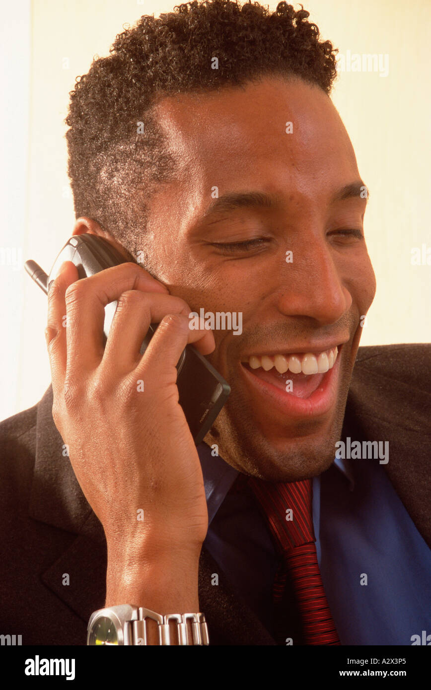Close-up of young man using mobile 'phone. Stock Photo