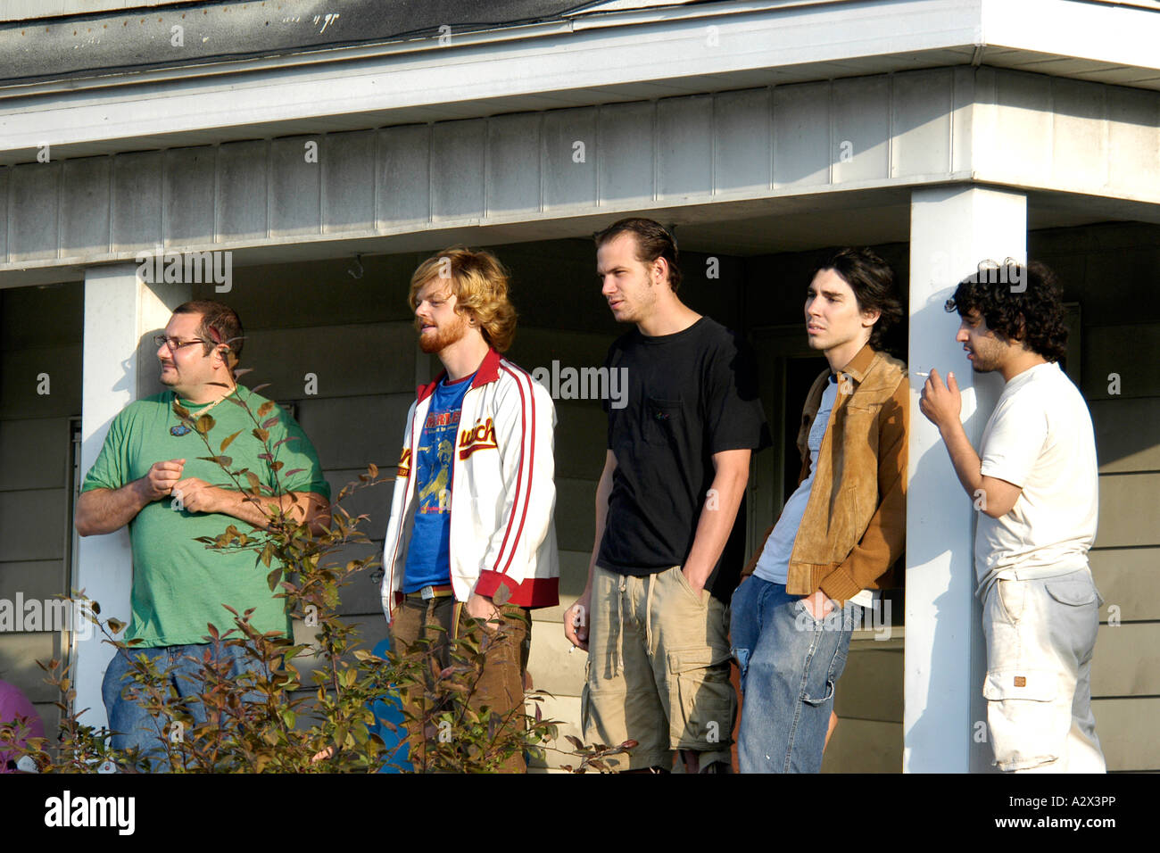 Group of Student males standing outside their house chilling out Stock Photo
