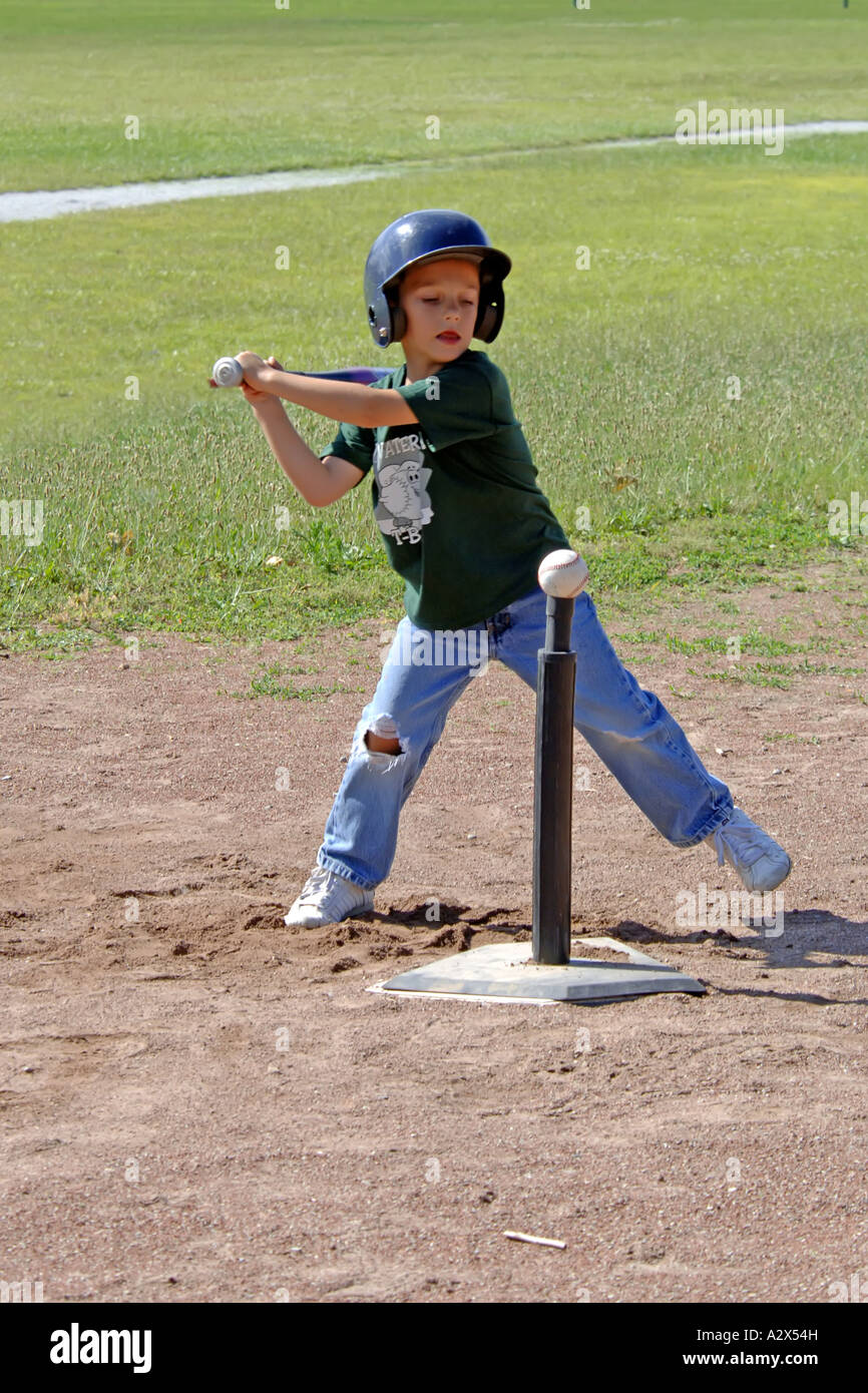 Young boy swinging a baseball bat at a Pre-K T-Ball practice game Stock  Photo - Alamy